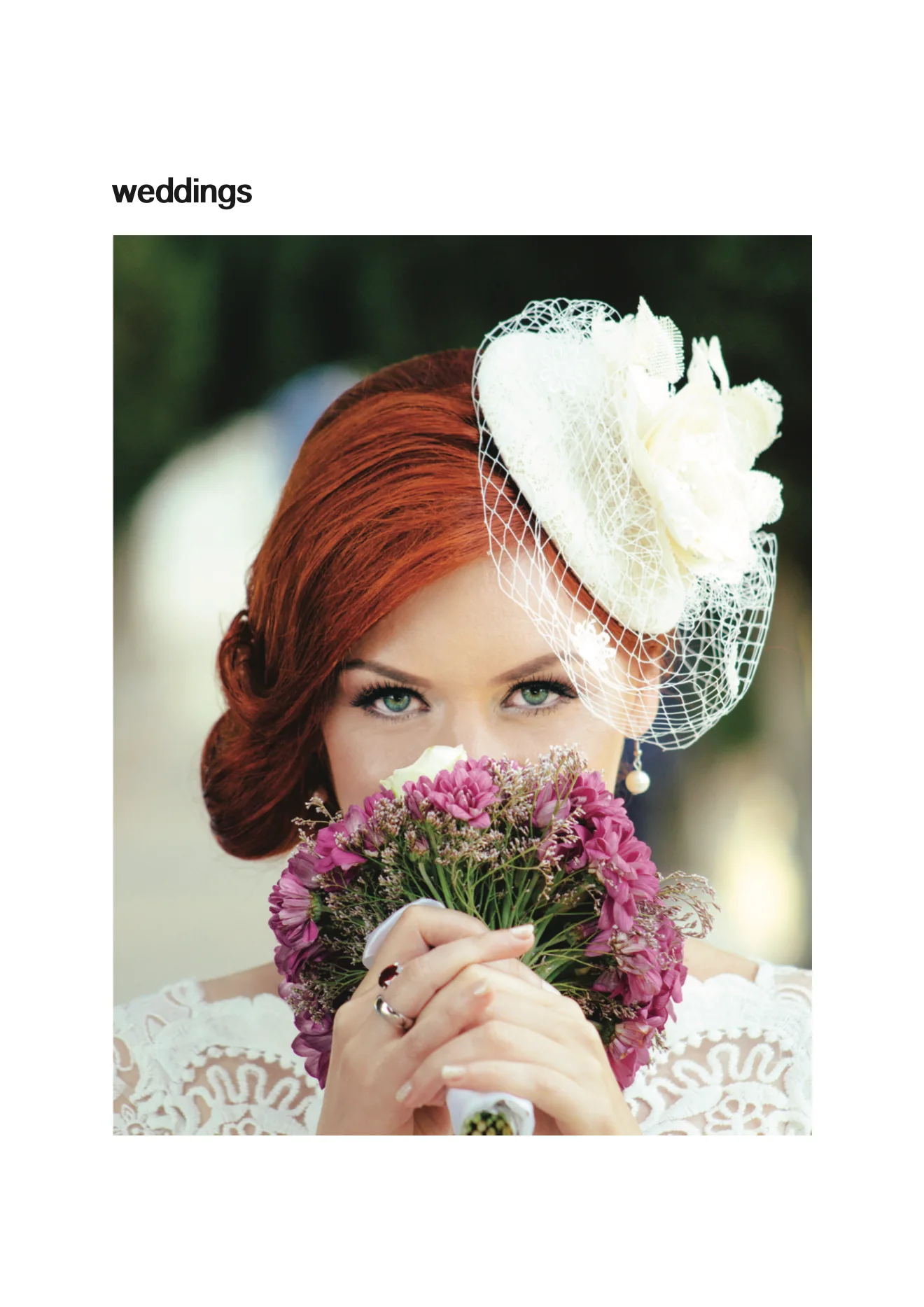 weddings: a red-haired bride in a white hat, holding a bouquet to her face
